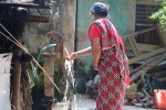 Woman collecting water in Phulakhrara village [Photo credit: waterdotorg at https://www.flickr.com/photos/waterdotorg/19365390491/]