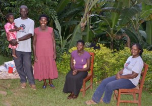 Feredasi Nganwa (second from left), VHCT volunteer, along with members of her community, and Dr. Gladys Kalema-Zikusoka (right)