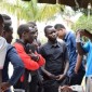 A peer educator carrying out a group session on condom use focusing on male involvement in family planning with students of UICT