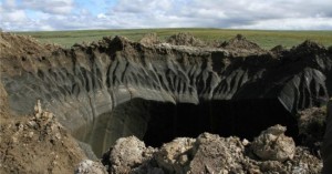 Figure 1. A mysterious crater in the Yamal region of Siberia. One of many recently discovered. A sign of a runaway methane feedback loop? (Credit: Public Domain)
