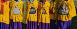 Six special Maasai ladies wearing special shukas for a special occasion: Student Celebration. These are Maasai Harmonial's two medical interpreters (left) and four craft leaders (right)